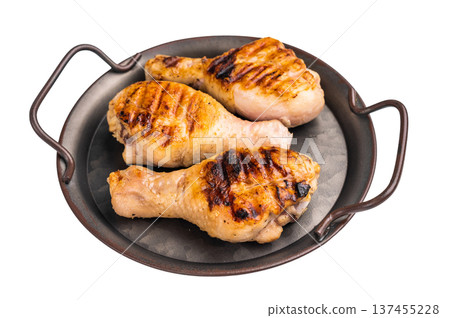 Savory BBQ chicken legs, drumsticks beautifully caramelized on the grill, ready to be enjoyed with your favorite dipping sauce. isolated on white background. top view Savory BBQ chicken legs, drumsticks beautifully caramelized on the grill, ready to be enjoyed with your favorite dipping sauce. isolated on white background. top view 137455228