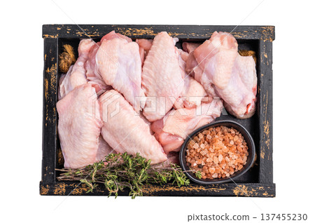 Beautifully arranged raw chicken wings, ready to soak up your favorite marinades for a tasty culinary adventure. isolated on white background. top view Beautifully arranged raw chicken wings, ready to soak up your favorite marinades for a tasty culinary adventure. isolated on white background. top view 137455230