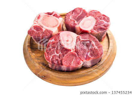 Beautifully marbled raw veal ossobuco, perfect cross cut shank meat for traditional Italian recipes and savory family dinners. isolated on white background. top view Beautifully marbled raw veal ossobuco, perfect cross cut shank meat for traditional Italian recipes and savory family dinners. isolated on white background. top view 137455234