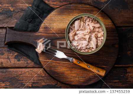 Freshly opened tinned canned tuna, showcasing its rich texture and flavor, a must-have for any pantry. isolated on white background. top view Freshly opened tinned canned tuna, showcasing its rich texture and flavor, a must-have for any pantry. isolated on white background. top view 137455259