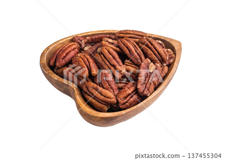 Shelled pecan nuts in a wooden bowl on a clean white background creating a simple natural ingredient shot ideal for culinary and healthy food themes 137455304