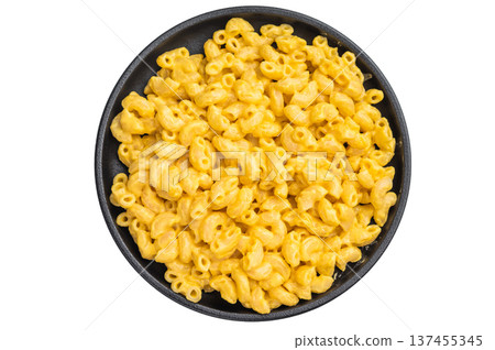 Savory mac and cheese dish with rich cheese sauce, presented on black plate with minimalist white background Savory mac and cheese dish with rich cheese sauce, presented on black plate with minimalist white background 137455345