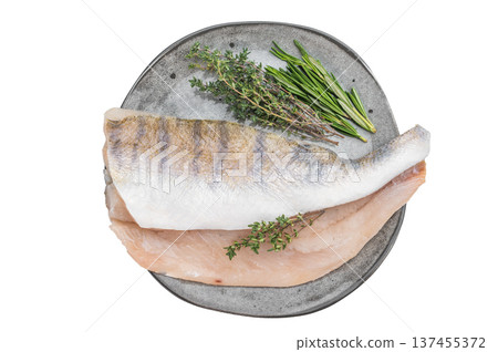 Raw pike perch fillets with skin and fresh herbs on light background, lean freshwater white fish for healthy cooking. Raw pike perch fillets with skin and fresh herbs on light background, lean freshwater white fish for healthy cooking. 137455372