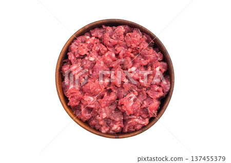 Raw chopped meat served in a wooden bowl over white surface perfect for recipe concepts culinary ads and protein rich food photography. Raw chopped meat served in a wooden bowl over white surface perfect for recipe concepts culinary ads and protein rich food photography. 137455379