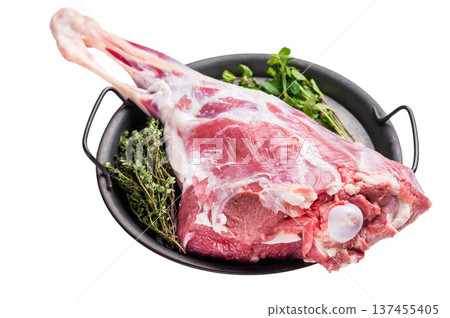 Uncooked whole lamb leg, raw mutton meat with herbs for cooking isolated on white background. top view 137455405
