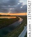 Sunset seen from the river bank 137455427