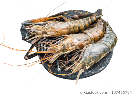 Uncooked rosenbergii fresh water shrimp ready for preparation, perfect for chefs looking to create exquisite seafood dishes. isolated on white background. top view 137455794