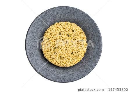 Twisted raw ramen noodles, ready to soak up flavors and bring warmth to your next culinary adventure. isolated on white background. top view Twisted raw ramen noodles, ready to soak up flavors and bring warmth to your next culinary adventure. isolated on white background. top view 137455800