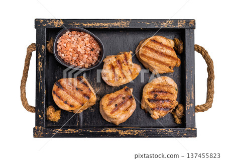 Tender char grilled pork medallion steak, perfect for adding a touch of elegance to your dinner plate. isolated on white background. top view Tender char grilled pork medallion steak, perfect for adding a touch of elegance to your dinner plate. isolated on white background. top view 137455823