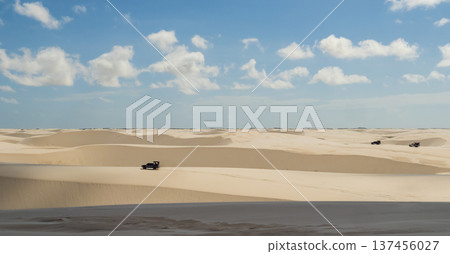 Lencois Maranhenses National Park with off-road vehicles crossing white sand dunes, Maranhao, Brazil 137456027