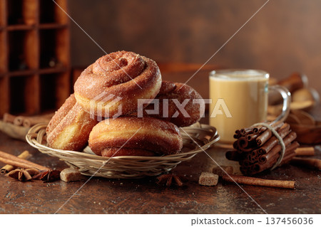 Swedish cinnamon rolls and coffee latte on a brown background. 137456036