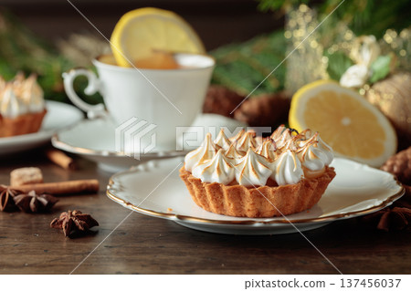 Meringue lemon tart and cup of tea. 137456037