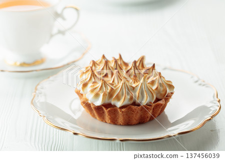 Meringue tart on a white table. Meringue tart on a white table. 137456039