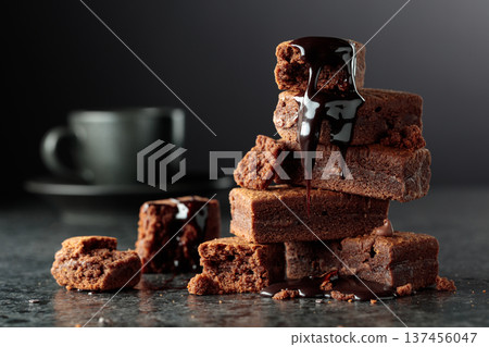 Brownie pieces on a black background. Brownie pieces on a black background. 137456047