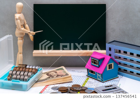Image of a drawing doll pointing at a blackboard and tax returns and mortgage deductions Image of a drawing doll pointing at a blackboard and tax returns and mortgage deductions 137456541