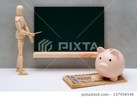 A drawing doll pointing at a blackboard, a 10,000 yen bill, and a piggy bank 137456546