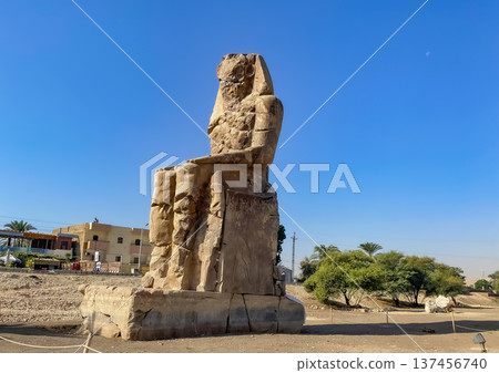 Colossi of Memnon, two massive stone statues representing the pharaoh, Luxor, Egypt Colossi of Memnon, two massive stone statues representing the pharaoh, Luxor, Egypt 137456740