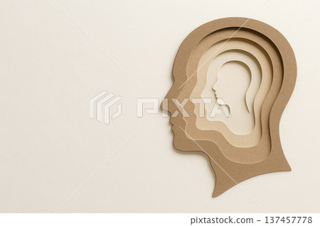 A multi-layered silhouette of a human head made of paper. Space for text. A multi-layered silhouette of a human head made of paper. Space for text. 137457778