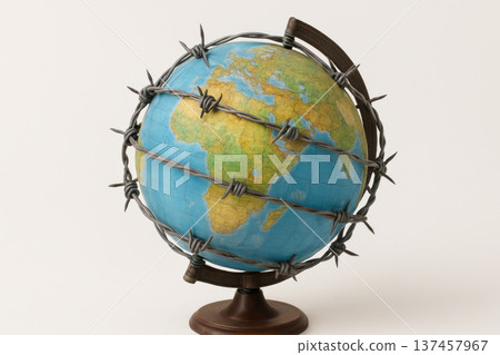 A globe wrapped in barbed wire. A globe wrapped in barbed wire. 137457967
