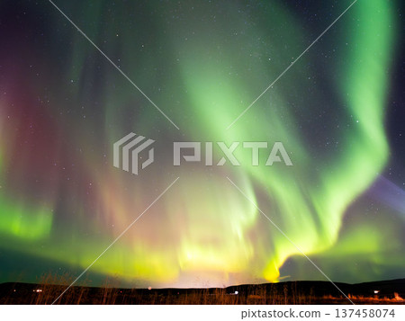 Aurora covering the night sky Aurora covering the night sky 137458074