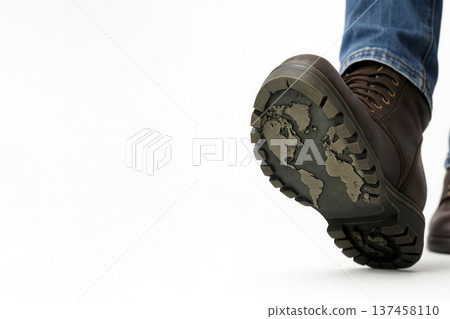 Shoe footprint with a world map imprint on a white background. Space for text. 137458110