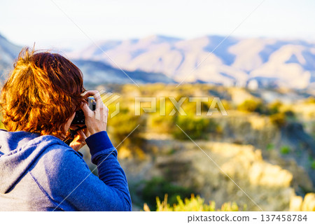 Woman take photos from Tabernas desert in Spain 137458784