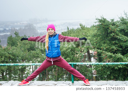 Woman exercising outside during autumn Woman exercising outside during autumn 137458933