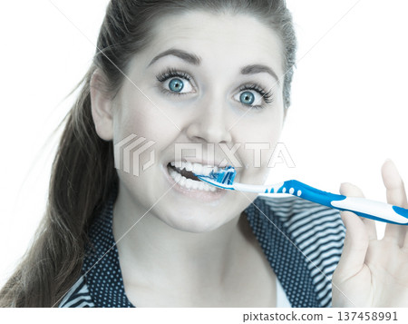 Woman brushing cleaning teeth. Woman brushing cleaning teeth. 137458991
