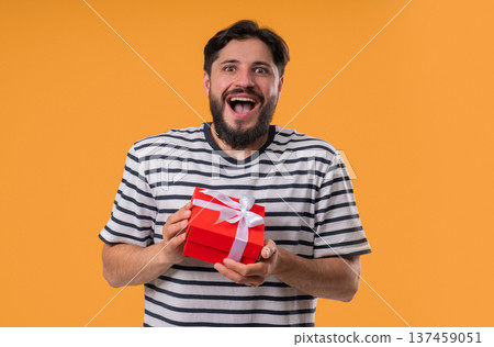 Happy Mature Bearded Man Gift Box Yellow Background. Guy Smiling,Whats Inside 137459051