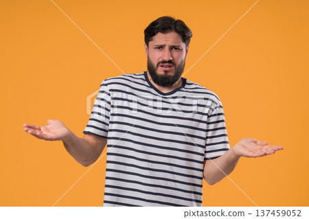 Mature Man Shrugs Shoulders Showing Uncertainty, Confusion, Dilemma, Hesitation 137459052