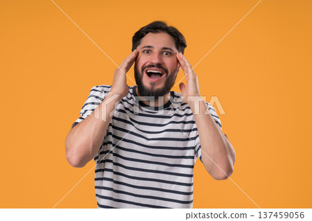 Impressed bearded man shocked, WOW.Handsome guy surprised to camera over Yellow Impressed bearded man shocked, WOW.Handsome guy surprised to camera over Yellow 137459056
