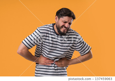 Man Squeezing Belly With Hands, Abdominal Pain. Adult Guy Suffering Stomach Ache Man Squeezing Belly With Hands, Abdominal Pain. Adult Guy Suffering Stomach Ache 137459063