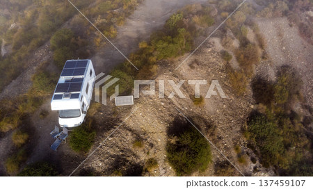 Caravan solar panels on roof camping on nature. Aerial view 137459107