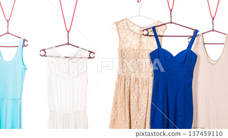 Colorful dresses hanging on clothes hanger 137459110