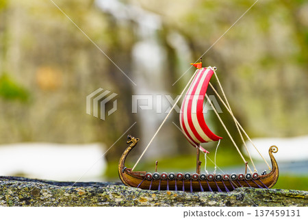 Viking boat on fjord shore, Norway 137459131