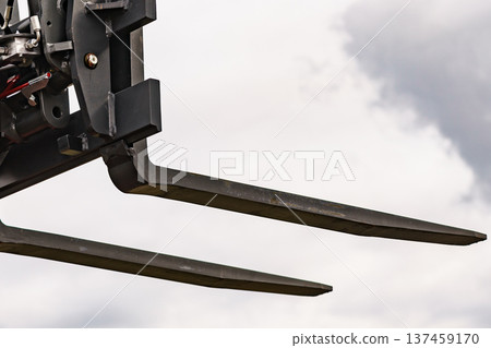 Forklift industrial loader or stacker against sky. Forklift industrial loader or stacker against sky. 137459170