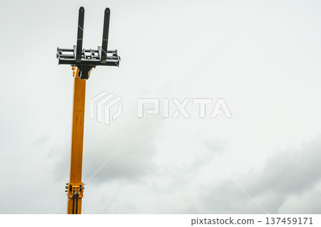 Forklift industrial loader or stacker against sky. 137459171