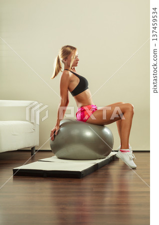 woman doing fitness exercises with fit ball woman doing fitness exercises with fit ball 137459534