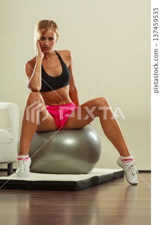 woman doing fitness exercises with fit ball woman doing fitness exercises with fit ball 137459535