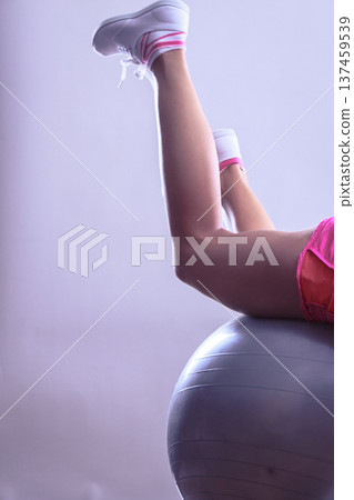 woman doing fitness exercises with fit ball woman doing fitness exercises with fit ball 137459539
