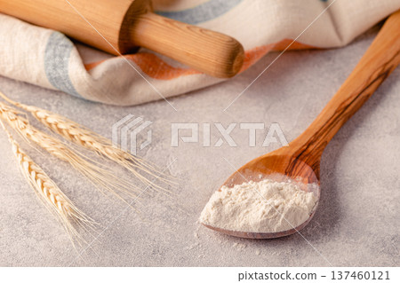 Ingredients for baking - flour, spoon, rolling pin. 137460121