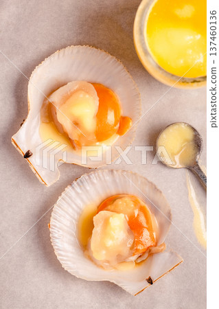 Raw scallops with melted butter Raw scallops with melted butter 137460136