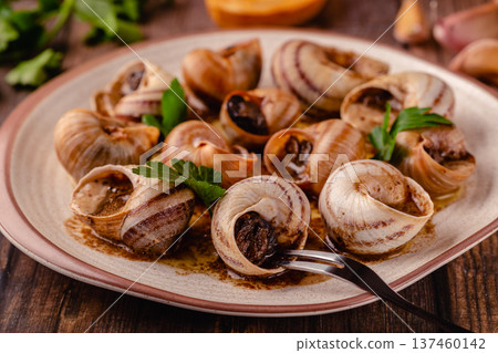 snails with butter on a plate snails with butter on a plate 137460142