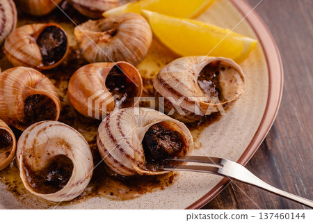 snails with butter on a plate snails with butter on a plate 137460144