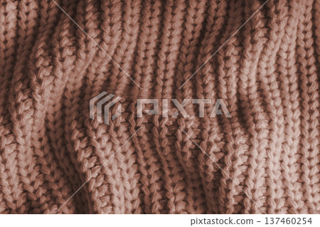 Crumpled brown knitted fabric texture with folds, wrinkles and soft waves, wool background Crumpled brown knitted fabric texture with folds, wrinkles and soft waves, wool background 137460254