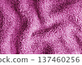 Crumpled fluffy pink terry towel microfiber fabric texture with wrinkles and waves background 137460256