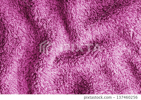 Crumpled fluffy pink terry towel microfiber fabric texture with wrinkles and waves background Crumpled fluffy pink terry towel microfiber fabric texture with wrinkles and waves background 137460256