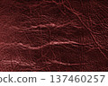 Detailed red colored wrinkled textured leather with natural creases texture background 137460257