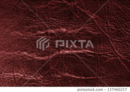 Detailed red colored wrinkled textured leather with natural creases texture background 137460257