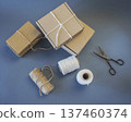 Cardboard boxes and packing twine, delivery concept. Stacking of postal cardboard boxes and packing twine. 137460374